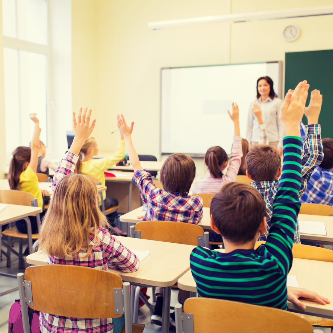 teacher in classroom of kids