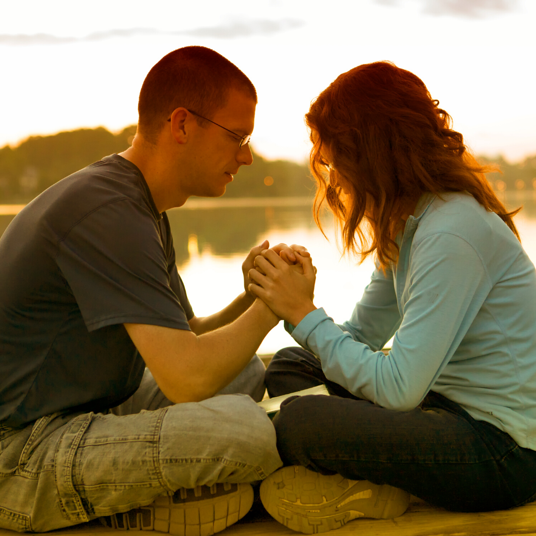 husband and wife praying together