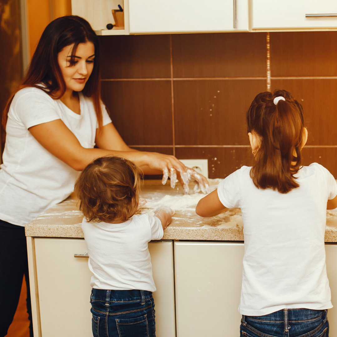 mother and children cooking together