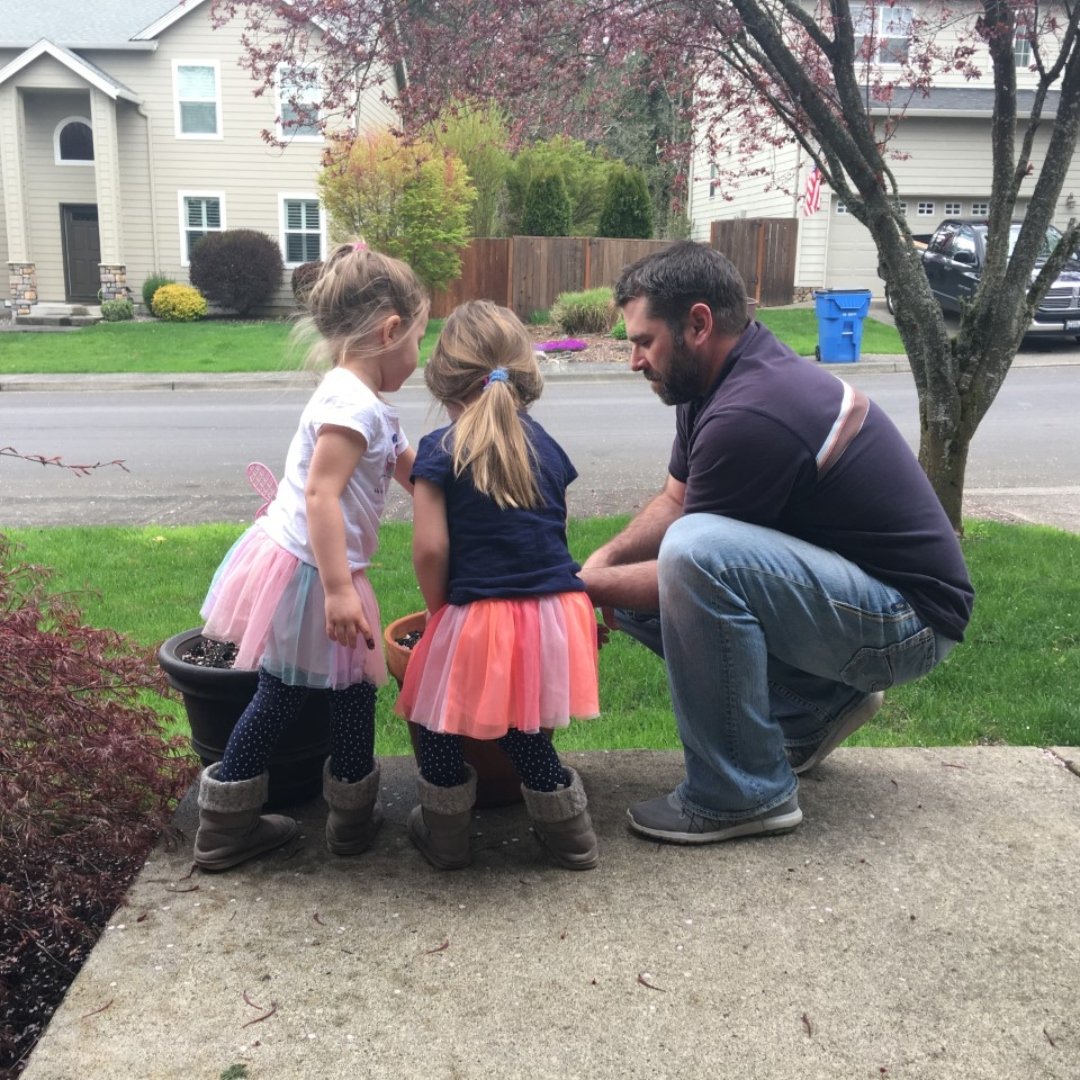 children and father planting