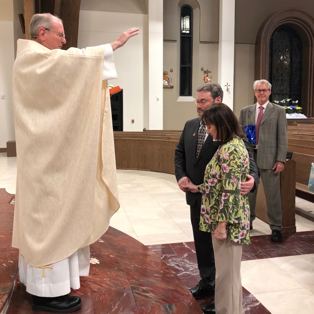 married couple receiving a blessing