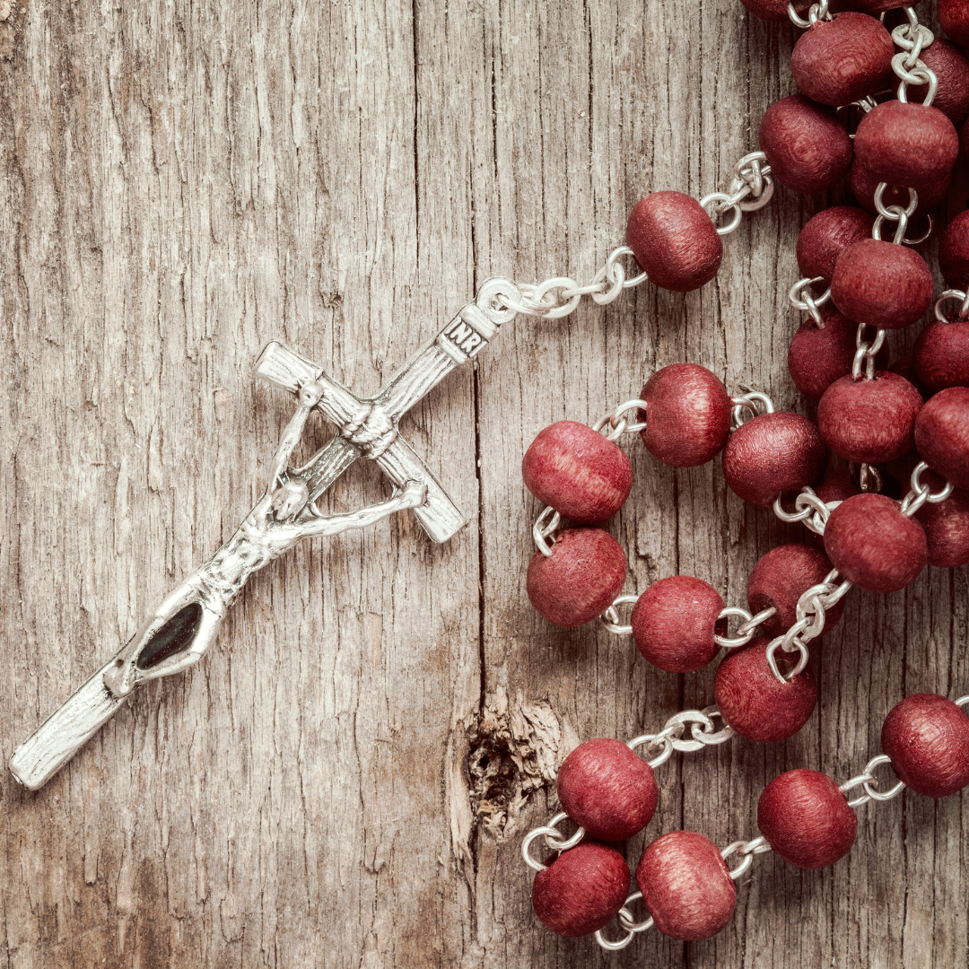 red Rosary with silver crucifix