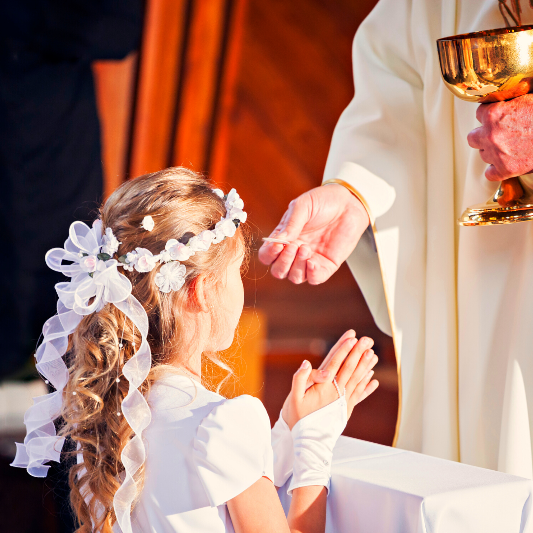 girl receiving first Communion