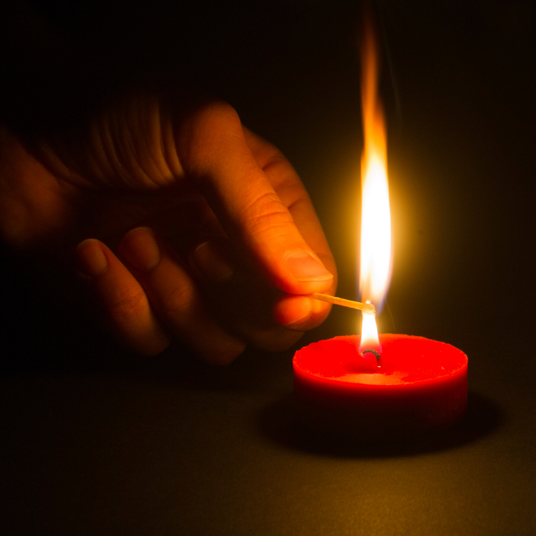 lighting a red candle