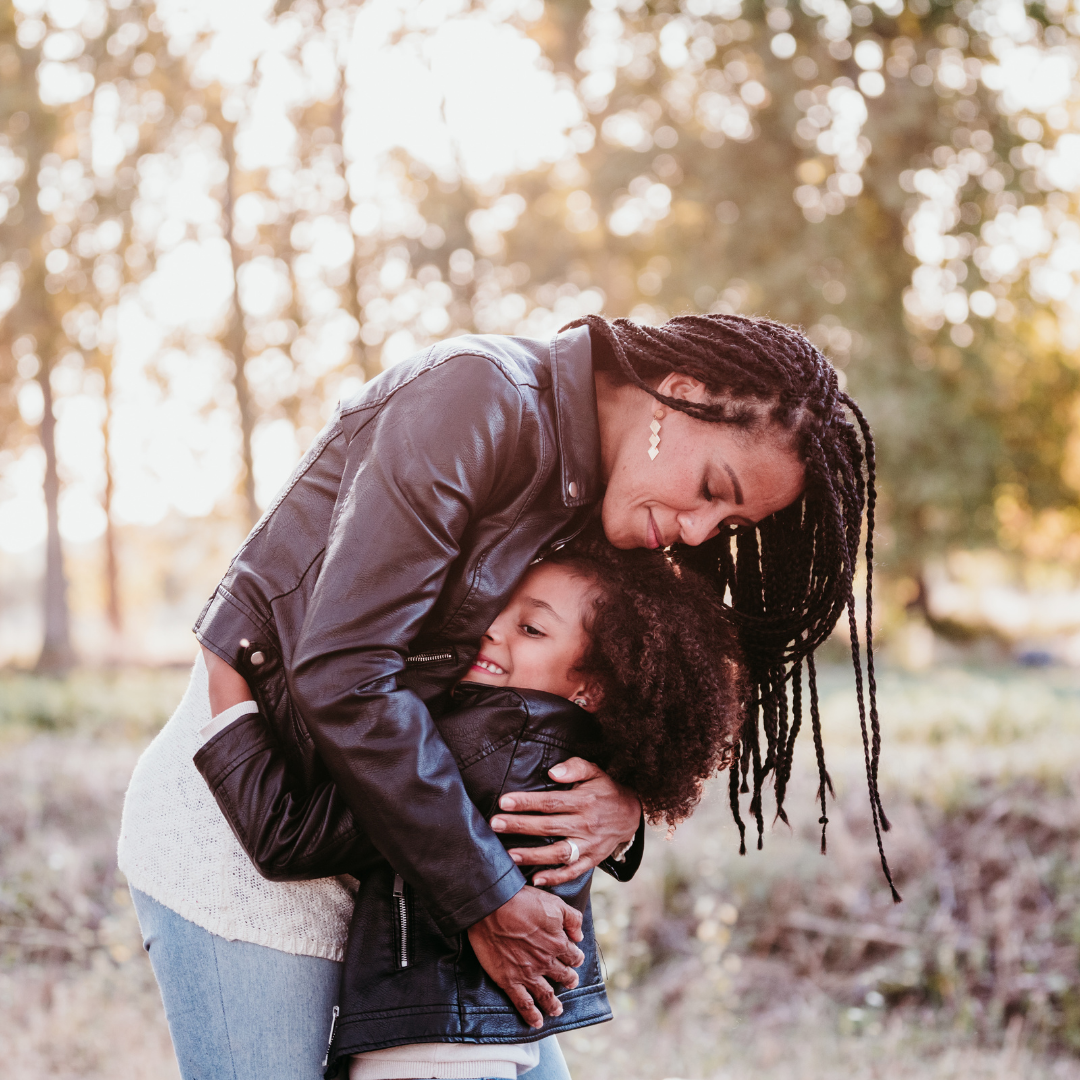 mom and daughter hugging