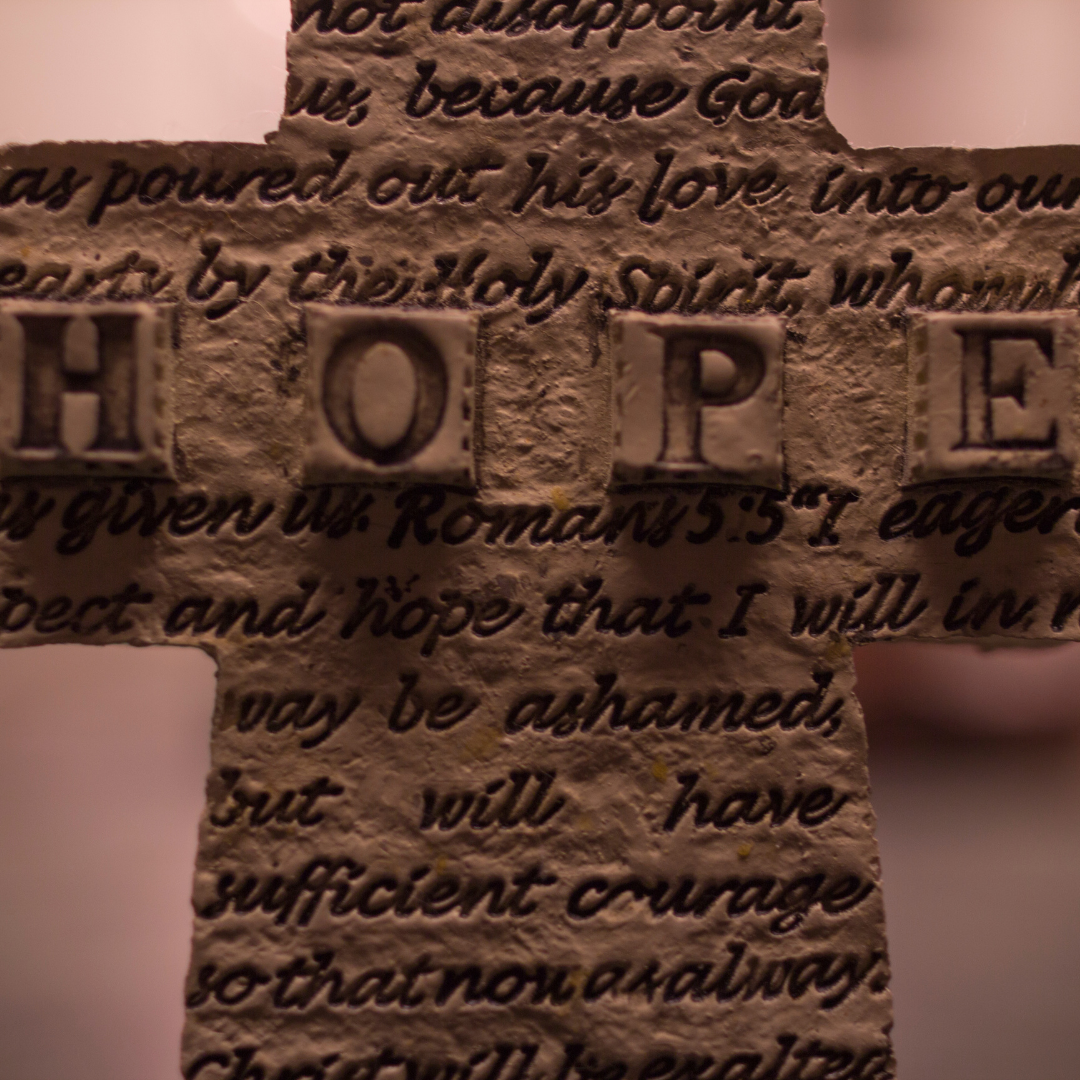 cross with the word HOPE and Scripture verses on it