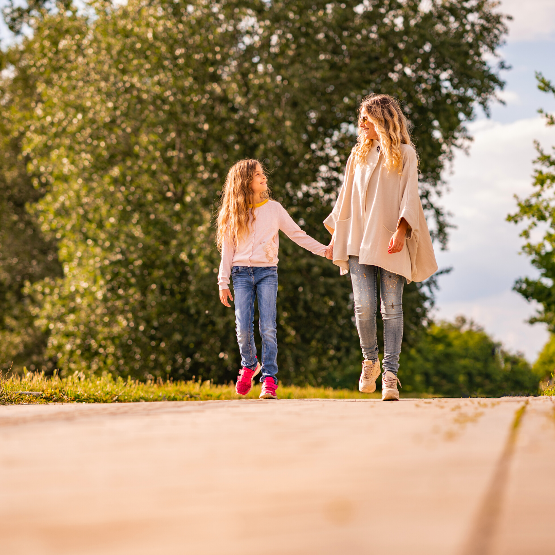 mom and daughter walking