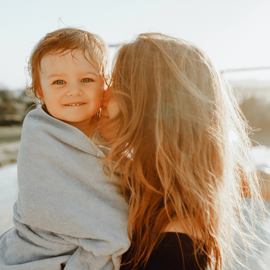 mom hugging small child