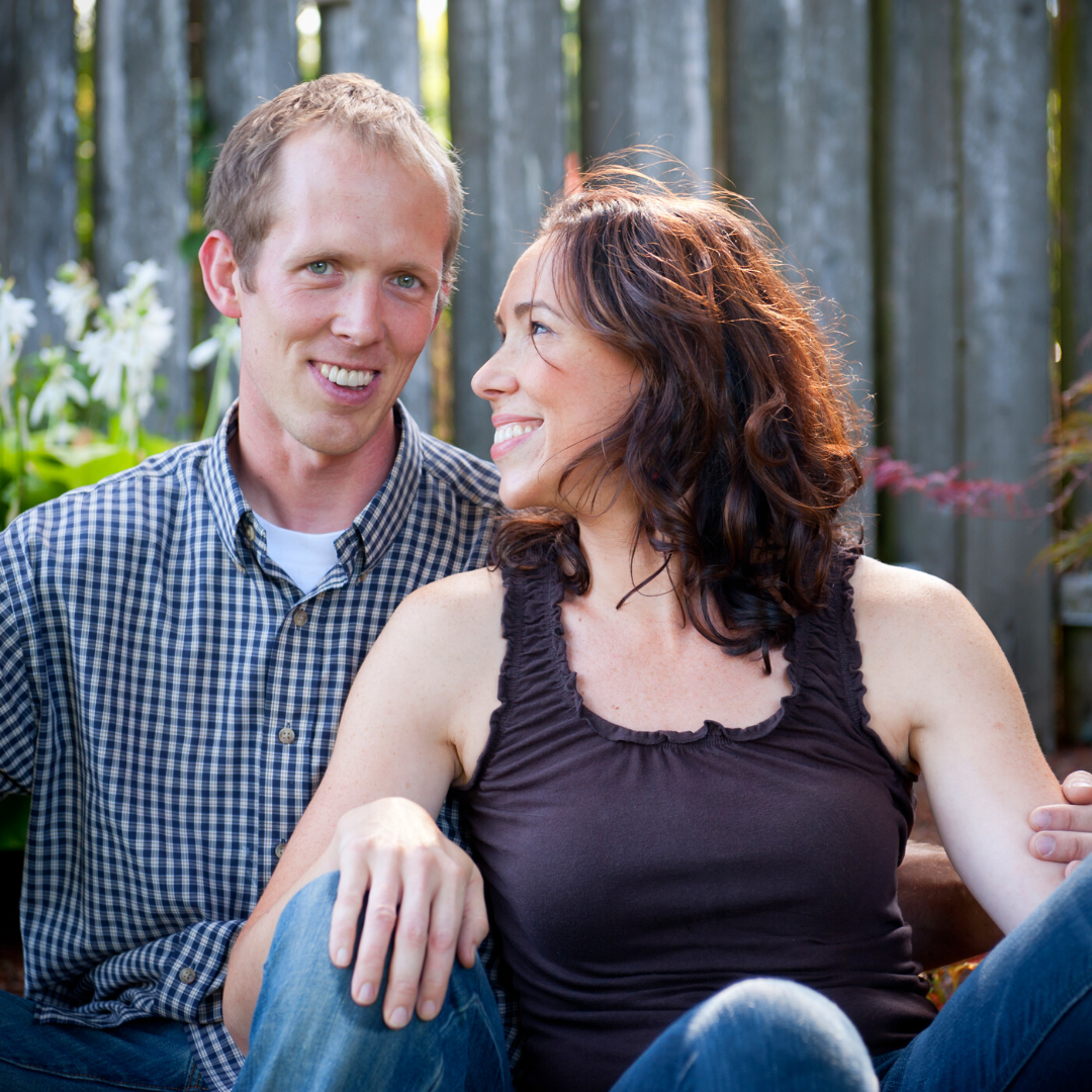 happy couple sitting outside