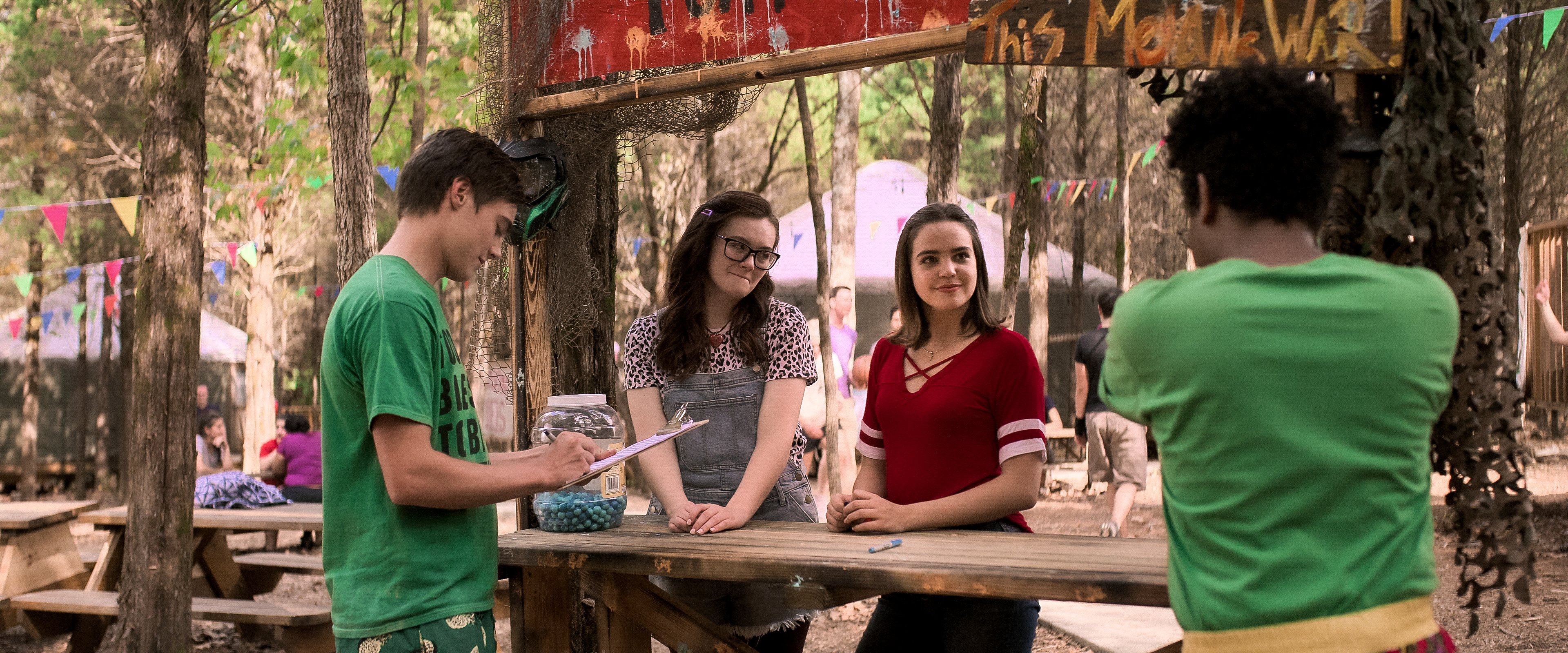 teenagers at craft station at camp