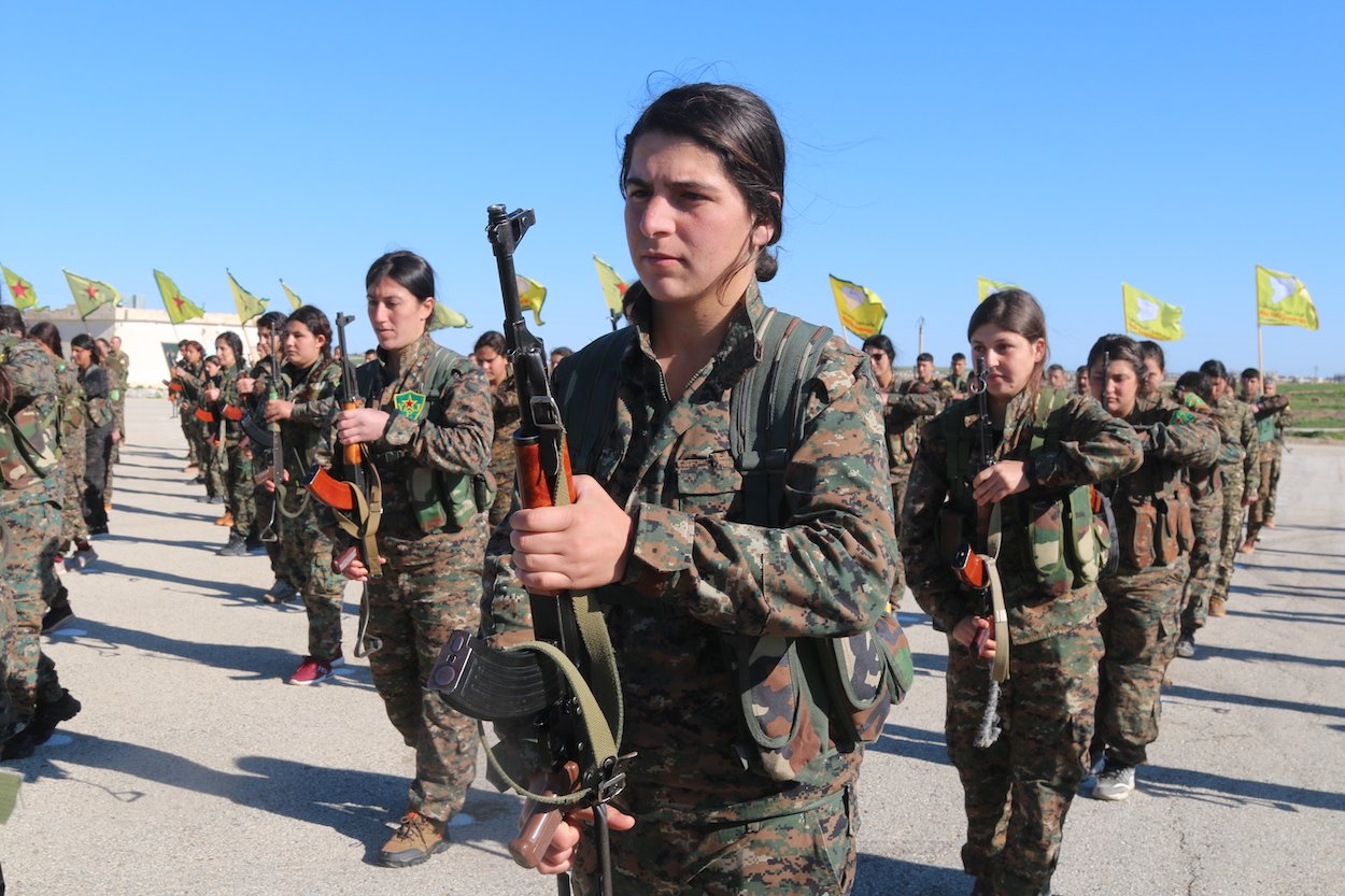 All-female militia fighting against the Islamic State stand in formation. Photo courtesy of: The Daughters of Kobani