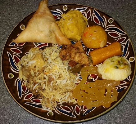Briyani mutton, samosa, dal, Jalebi and Laddu, by Marianna Bartholomew. All rights reserved.
