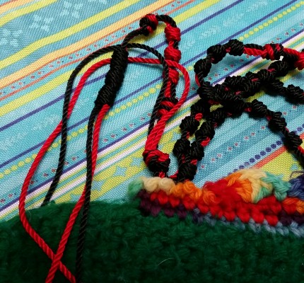 Grandma's hand-knit slipper and my nearly-completed cord Rosary.