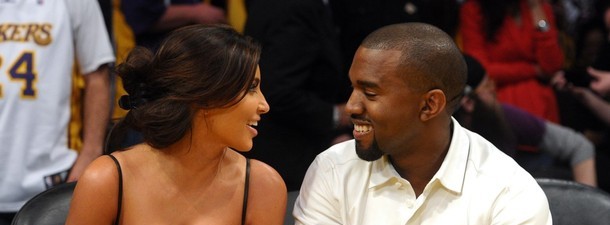 LOS ANGELES, CA - MAY 12: Kim Kardashian and Kanye West talk from their courtside seats before the Los Angeles Lakers take on the Denver Nuggets in Game Seven of the Western Conference Quarterfinals in the 2012 NBA Playoffs on May 12, 2012 at Staples Center in Los Angeles, California. (Photo by Noel Vasquez/Getty Images)
