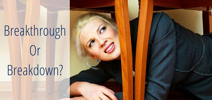 An image of a businesswoman hiding under chairs to signify fear and reluctance.