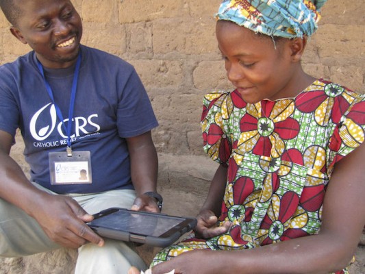 CRS staff uses ICT4D devices to register internally displaced, vulnerable households for a non-food item fair involving local vendors in the Pweto territory of the DRC. CRS DRC’s CAPABLE (Capacity Building for Leadership in Emergencies) project provides the tools needed for affected communities to develop long-term resilience in the Katanga Province's so-called Triangle of Death—a group of three territories that have faced rising insecurity due to prolonged conflict since the end of 2011.