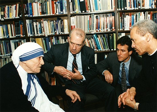 Our senior staff listen attentively to Mother Teresa as she visits CRS headquarters in 1996. From left to right are former President Ken Hackett, Chief Operating Officer Sean Callahan—who served with her in India—and former Board Chairman Bishop John Ricard. Photo by CRS staff