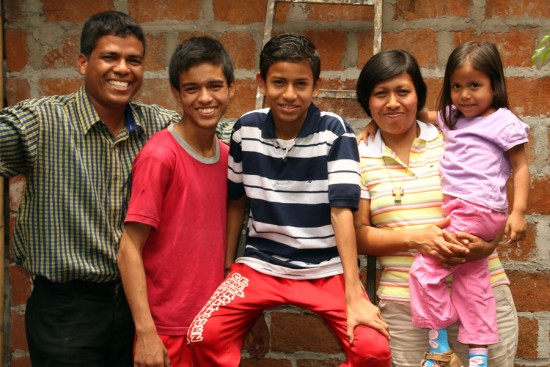 Beautiful smiles fill the home of Carlos (left) and Ena (second from right), shown here with three of their children, Carlos Elias (second from left), Cesar Gabriel (center) and Laura Valeria.