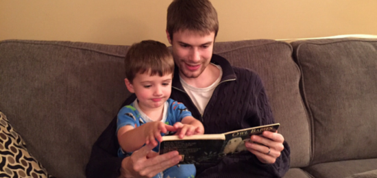 The author's son and grandson reading together. Licensed by the author.