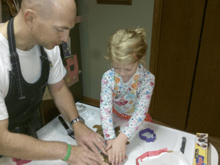 Dad and daughter, baking together.