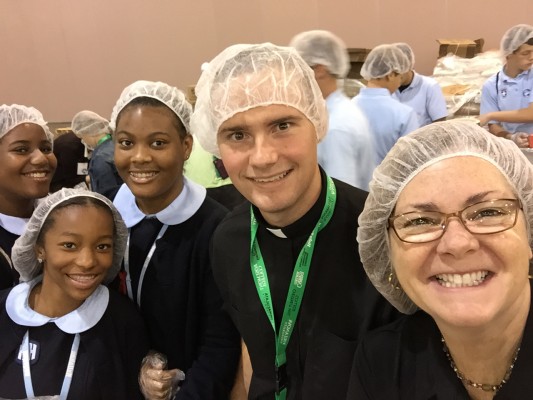 Students and seminarians join Lisa Hendey at the CRS Helping Hands event. Courtesy of Lisa Hendey. All rights reserved.