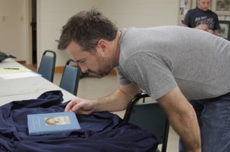 Writer-director Cliff Vaughn gets a first look at Brother Joseph's copy of Saint Theresa's autobiography 