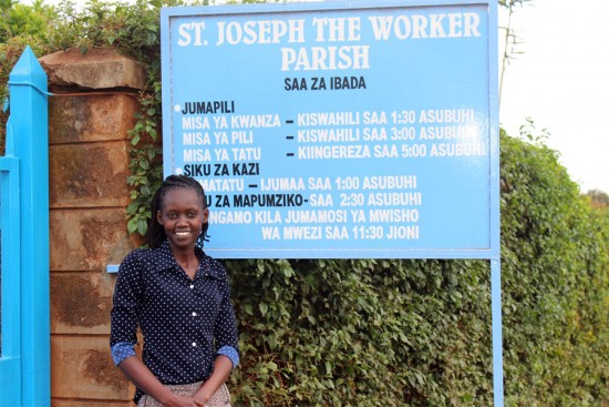 Jacinta Wanjiku, a social worker with Unbound in Kenya, stands outside her church, St. Joseph the Worker in Kangemi, where Pope Francis celebrated Mass and addressed the community.