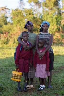 Mary Atieno Onyango, clockwise from left, with three of her four children, Quinter, Benter and Solomon. Mary was pregnant with her youngest Benter when she was first diagnosed as being HIV positive. With the help of a CRS trained community health worker, Mary was able to accept her status and rebuild her life. Photo by Sara A. Fajardo/CRS