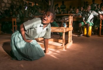 At the Karima Primary School in Malinda, Kenya, students of the Peace Club participate in a skit about child rights and child protection. Photo by Philip Laubner/CRS