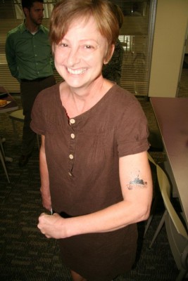 Kathy Greenholdt with Iggy tattoo. Copyright 2015 Loyola Press. All rights reserved.