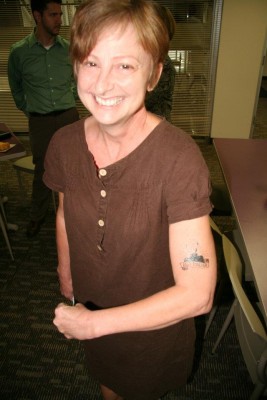 Kathy Greenholdt with Iggy tattoo. Copyright 2015 Loyola Press. All rights reserved.