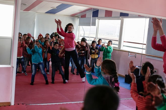 The CRS-supported Good Shepherd Sisters center in Deir al Ahmar, in Lebanon's Bekaa Valley, provides a range of classes—including dance—to some 350 refugee children, as well as a daily hot meal for every child. Photo by Sam Tarling for CRS