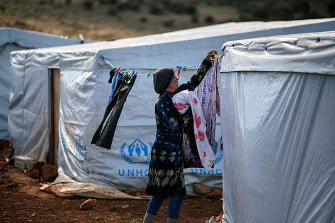 Abir, a Syrian mother of two, fled her home in Raqqa 11 months ago. Just before a recent snowstorm, the sisters helped refugees like Abir get sturdy tents from the United Nations High Commissioner for Refugees. Photo by Sam Tarling for CRS