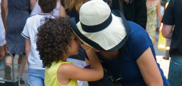 Photo by Ed Yourdon; Little girl whispering something in a woman's ear; Date: 18 July 2009; from https://commons.wikimedia.org, licensed under the Creative Commons Attribution-Share Alike 2.0 Generic license.