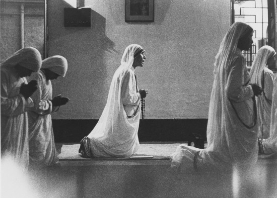 Mother Teresa is joined in prayer by her sisters, the Missionaries of Charity, in their chapel in Calcutta. Photo by CRS staff