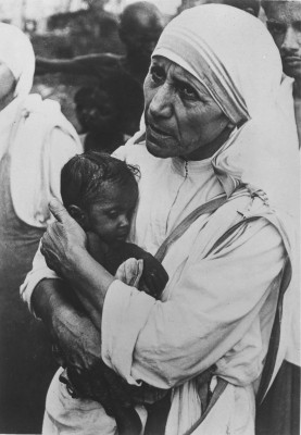 An infant finds comfort in Mother Teresa’s arms in India. Photo by CRS staff