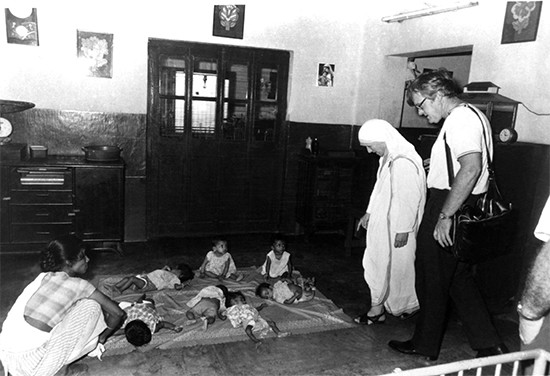 At a home for orphaned and abandoned children in Shishu Bavan, India, Mother Teresa watches over infants who would otherwise have been left to die. Photographed in 1975, these children would be 42-year-olds today. Photo by CRS staff