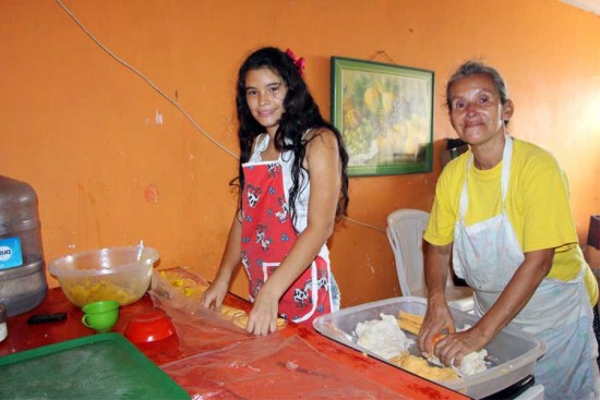 Nathalie helps her mother, Martha, make empanadas. Photo copyright 2016 Unbound. All rights reserved.