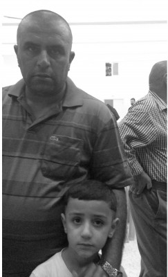 Recent arrival, Iraqi refugee Arthan and his youngest son