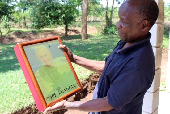 Mark, the father of a child sponsored through Unbound, works in his woodshop in Uganda.