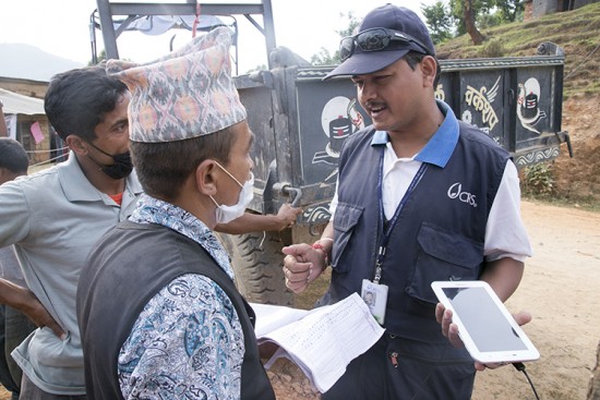 Montoring and evaluation are part of CRS's work, documenting the distribution of supplies electronically and tracking where relief is being distributed and how effectively it is being provided. Photo by Jennifer Hardy/CRS
