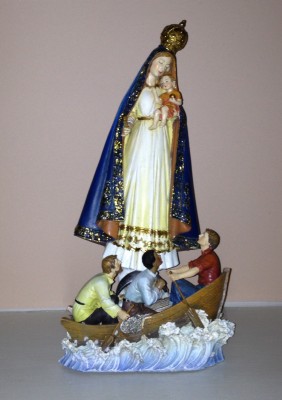 Our Lady of Charity keeps me company in my office.