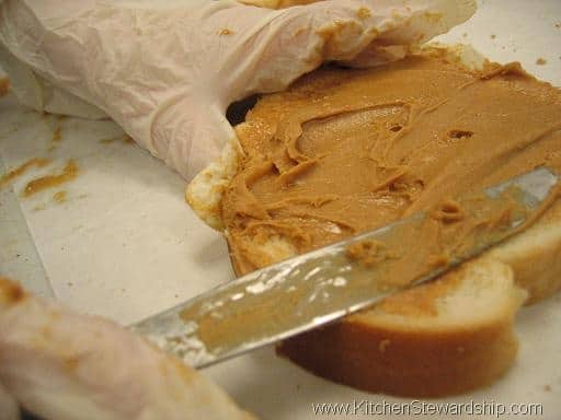Paul spreads peanut butter