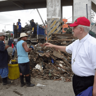 Archbishop Kurtz tours the areas hit by a typhoon in the Philippines.