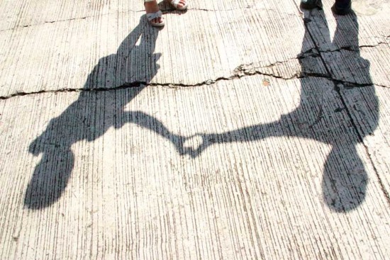 Children in the Philippines make a heart with their hands. Photo copyright 2015 Unbound. All rights reserved.