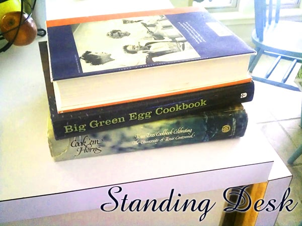 Create a standing desk with books on a countertop