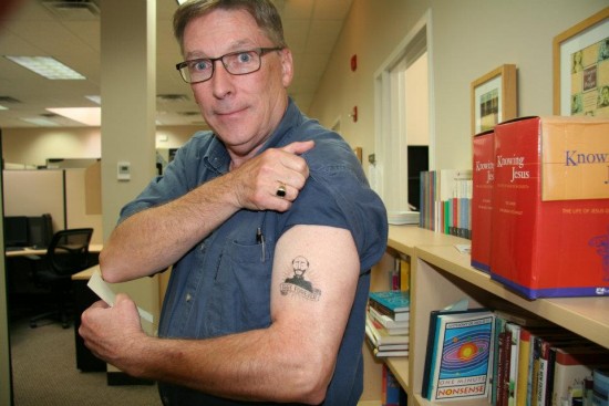 Tom McGrath with Iggy tattoo. Copyright 2015 Loyola Press. All rights reserved.