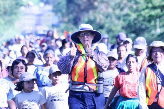 Bob Hentzen walks with families in Guatemala in 2009, at the start of his second marathon walk. His wife, Cristina (far right) walks with them.