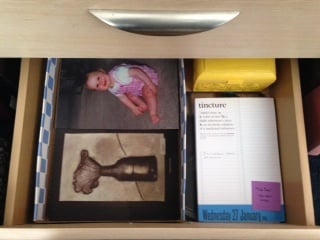 A recent repurposing of a drawer in my office led to a simple subdivision: calendar & file box on the right, papers on the left (atop the repurposed mouse pads).