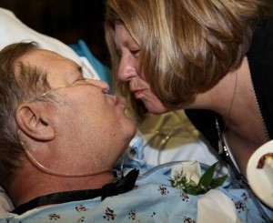 Russell Campion and Jan Schroeder kiss after exchanging wedding vows at the Nebraska Medical Center.